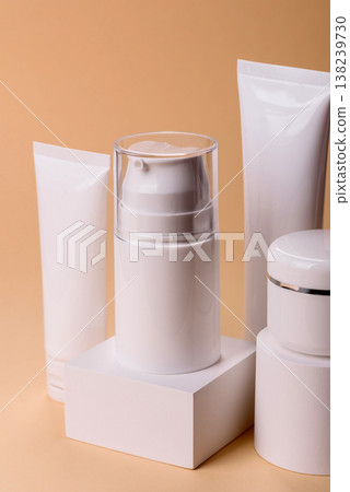 A set of empty white plastic or aluminum jars, tubes as mockup. Empty cosmetic jar and tube mockups A set of empty white plastic or aluminum jars, tubes as mockup. Empty cosmetic jar and tube mockups 138239730