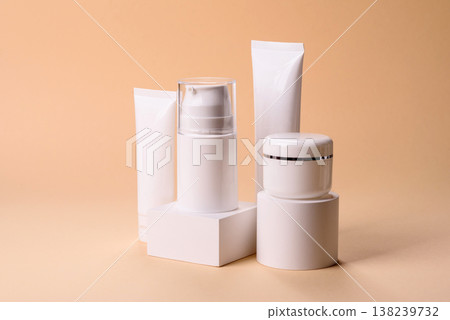 A set of empty white plastic or aluminum jars, tubes as mockup. Empty cosmetic jar and tube mockups 138239732
