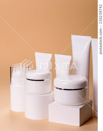 A set of empty white plastic or aluminum jars, tubes as mockup. Empty cosmetic jar and tube mockups 138239742