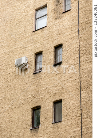 air conditioning on facade of building, air cooling in hot weather. air conditioning on facade of building, air cooling in hot weather. 138240061