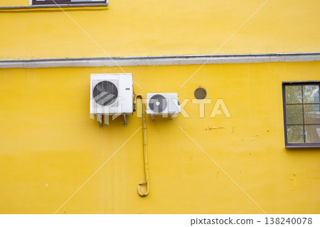 air conditioning on facade of building, air cooling in hot weather.  138240078