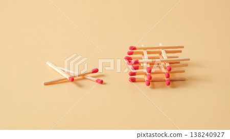 Pile of red head matchsticks on color background. Pile of red head matchsticks on color background. 138240927