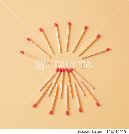 Pile of red head matchsticks on color background. Pile of red head matchsticks on color background. 138240929