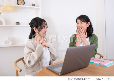 Mother and daughter rejoice at the announcement of the exam results. Mother and daughter rejoice at the announcement of the exam results. 138240950