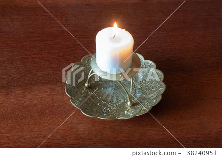 candle on a wooden background candle on a wooden background 138240951