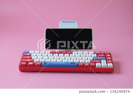 computer keyboard with mobile phone for gamer. computer keyboard with mobile phone for gamer. 138240974
