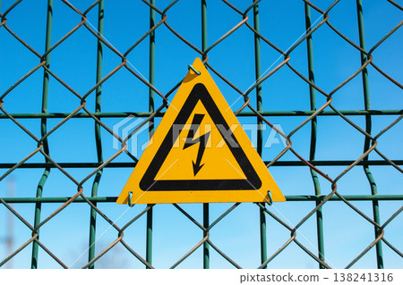 High Voltage Warning Sign on Chain-Link Fence 138241316