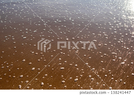 Sea Foam and Bubbles on Wet Sandy Beach Sea Foam and Bubbles on Wet Sandy Beach 138241447