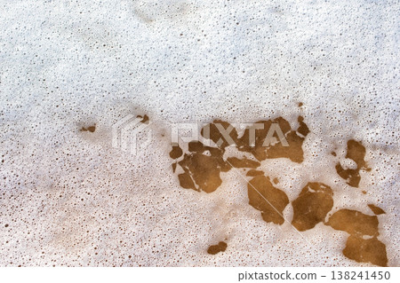 Sea Foam and Bubbles Texture on Wet Sand 138241450