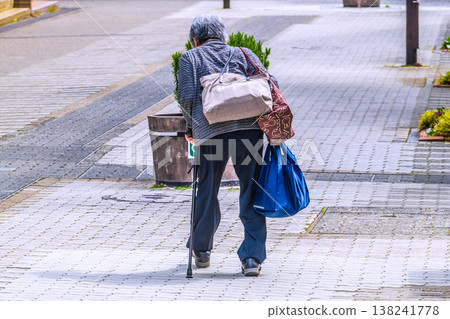 Yokohama, Japan: A cityscape of rolling hills... wooden benches... an aging society. An elderly woman with a cane... what is life...? = Yokohama city 138241778