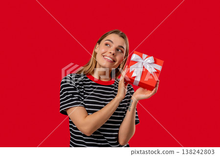 Happy Grateful Woman With Gift Box On Red Wall. Lady Smiling, Present, Surprise Happy Grateful Woman With Gift Box On Red Wall. Lady Smiling, Present, Surprise 138242803