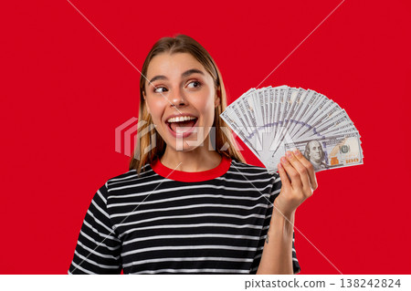 Rich Blonde Woman With Usd Cash Money Dollars Banknotes On Red, Income Payment Rich Blonde Woman With Usd Cash Money Dollars Banknotes On Red, Income Payment 138242824