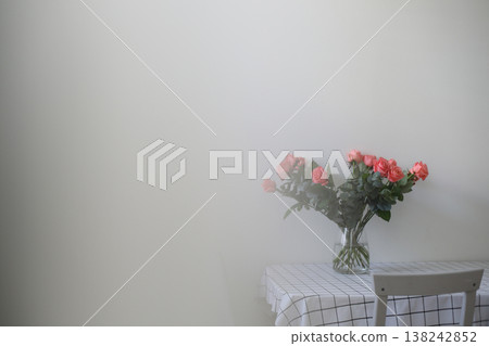 flowers in a vase. Home decoration and interior. Details of still life in the home interior of living room. Cozy spring concept. flowers in a vase. Home decoration and interior. Details of still life in the home interior of living room. Cozy spring concept. 138242852