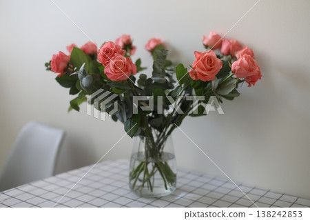 flowers in a vase. Home decoration and interior. Details of still life in the home interior of living room. Cozy spring concept. flowers in a vase. Home decoration and interior. Details of still life in the home interior of living room. Cozy spring concept. 138242853