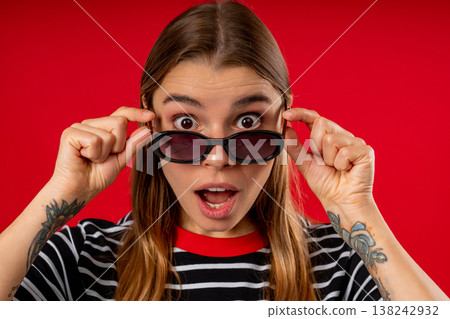 Amazed Pretty Woman Expresses Wow. Impressed Teen Girl On Red. Great News Amazed Pretty Woman Expresses Wow. Impressed Teen Girl On Red. Great News 138242932