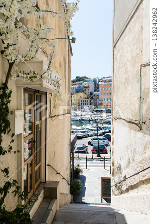 Pastel-colored buildings and alleyways under the bright sunlight on the French island of Corsica in the Mediterranean Sea. Pastel-colored buildings and alleyways under the bright sunlight on the French island of Corsica in the Mediterranean Sea. 138242962