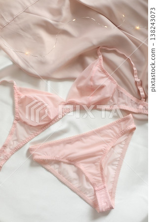Woman's lingerie on the bed sheets. Lace sexy female underwear. Beauty, fashion blogger concept. Female bra, panties, erotic clothes. Lingerie advertising Woman's lingerie on the bed sheets. Lace sexy female underwear. Beauty, fashion blogger concept. Female bra, panties, erotic clothes. Lingerie advertising 138243073