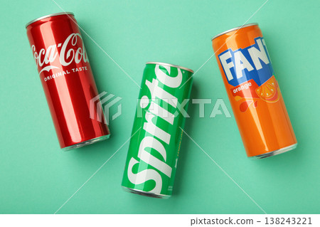 Mykolaiv, Ukraine - March 25, 2026: Iron cans of Coca Cola, Fanta and Sprite drink on mint background. 138243221