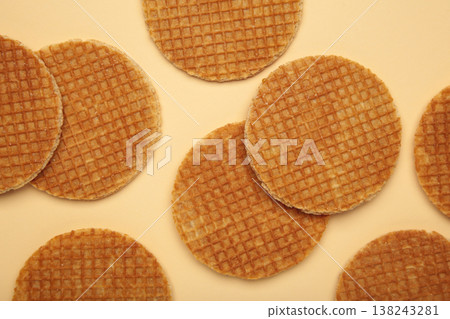 Dutch stroopwafel cookies or caramel waffles on beige background. Dutch stroopwafel cookies or caramel waffles on beige background. 138243281