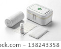 First aid kit with bandages and medical supplies on white background 138243358