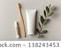 Minimal oral care set with toothbrush and toothpaste on neutral background 138243453