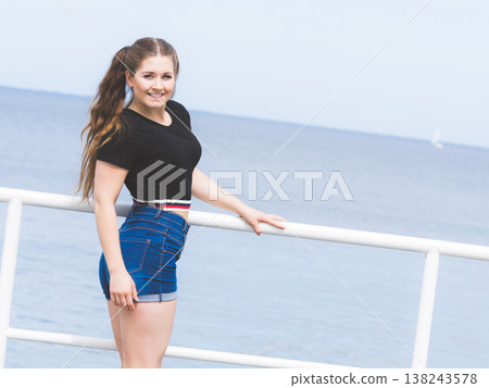 Happy teenager woman outside. 138243578