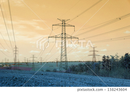Electricity pylons conducting current from distribution power station, blackout and grid stability concept, copy space Electricity pylons conducting current from distribution power station, blackout and grid stability concept, copy space 138243604