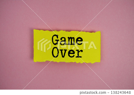 Game Over text written on paper rip 138243648