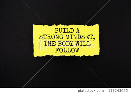 Build a Strong Mindset, The Body will Follow text written on paper rip Build a Strong Mindset, The Body will Follow text written on paper rip 138243655