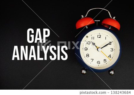 Gap Analysis text with alarm clock on black background Gap Analysis text with alarm clock on black background 138243684