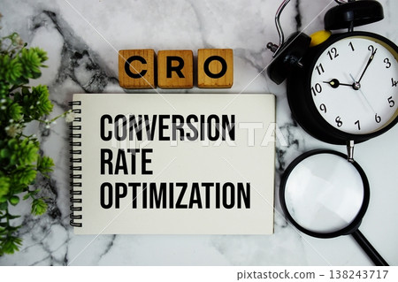 CRO Conversion Rate Optimization text with calculator and alarm clock on marble background CRO Conversion Rate Optimization text with calculator and alarm clock on marble background 138243717