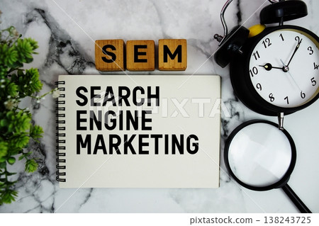 SEM Search Engine Marketing text with alarm clock and magnifying glass on marble background 138243725
