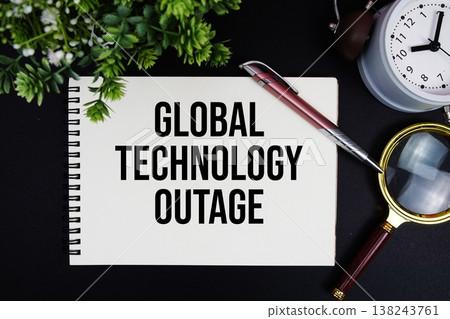 Global Technology Outage text with alarm clock and magnifying glass Global Technology Outage text with alarm clock and magnifying glass 138243761