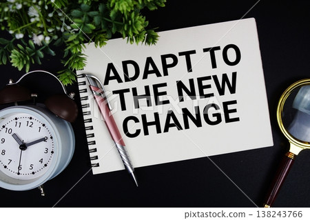 Adapt To The New Change text with alarm clock and magnifying glass 138243766