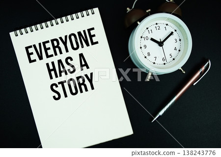 Everyone Has A Story text written on notepad with pen and alarm clock Everyone Has A Story text written on notepad with pen and alarm clock 138243776