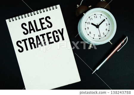 Sales Strategy text written on notepad with pen and alarm clock Sales Strategy text written on notepad with pen and alarm clock 138243788