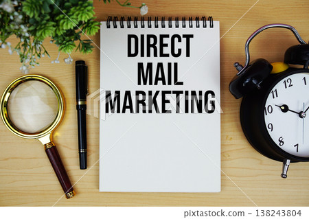 Direct Mail Marketing text written on notepad with alarm clock and magnifying glass flat lay on wooden background Direct Mail Marketing text written on notepad with alarm clock and magnifying glass flat lay on wooden background 138243804
