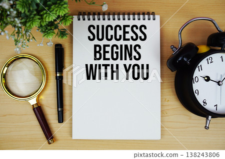 Success Begins With You text written on notepad with alarm clock and magnifying glass flat lay on wooden background Success Begins With You text written on notepad with alarm clock and magnifying glass flat lay on wooden background 138243806