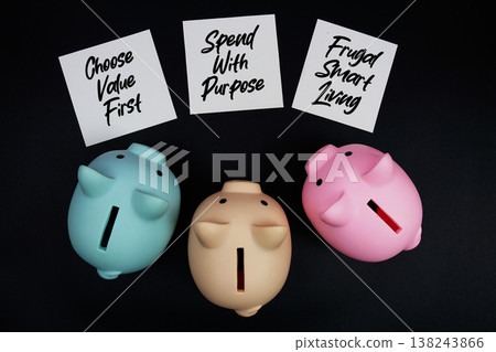 Three piggy banks with sticky note written "Choose Value First," "Spend with Purpose," and "Frugal Smart Living," financial planning goals on a black background Three piggy banks with sticky note written "Choose Value First," "Spend with Purpose," and "Frugal Smart Living," financial planning goals on a black background 138243866