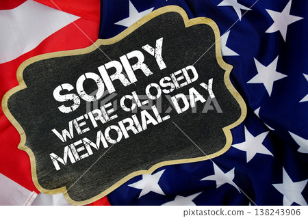 Sorry We're Closed Memorial Day written on blackboard with USA flag background Sorry We're Closed Memorial Day written on blackboard with USA flag background 138243906