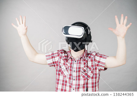 Gamer man wearing VR Gamer man wearing VR 138244365