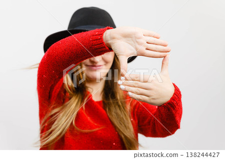 Young lady making camera gesture. Young lady making camera gesture. 138244427