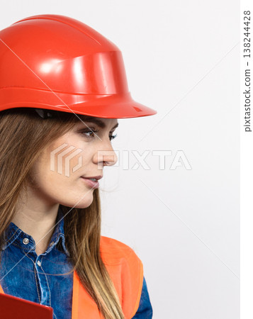 Woman engineer construction builder in helmet. Woman engineer construction builder in helmet. 138244428