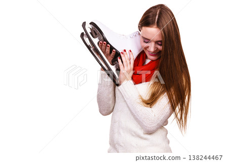 Smiling woman with ice skates 138244467