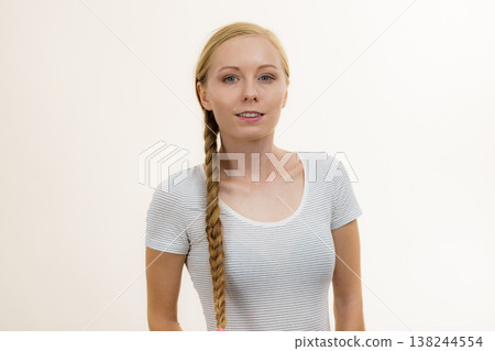 Blonde girl with long braid hair 138244554