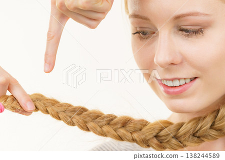 Blonde young woman with braid hair 138244589