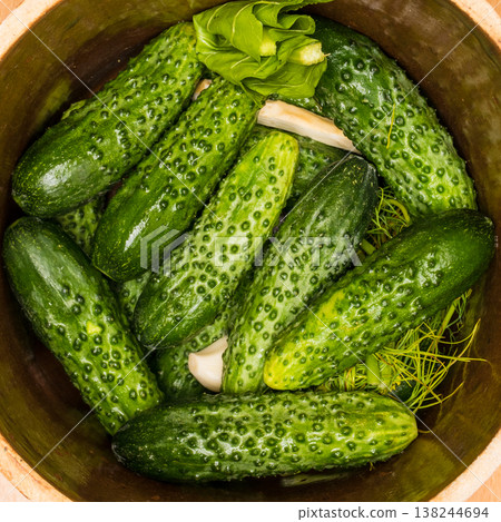 Making pickled cucumbers in clay jar Making pickled cucumbers in clay jar 138244694