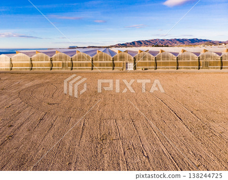 Aerial view. Commercial greenhouses on coast, Spain. Aerial view. Commercial greenhouses on coast, Spain. 138244725