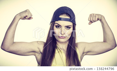 Woman casual style showing off muscles biceps 138244796