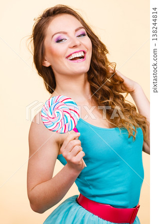 Woman joyful girl with lollipop candy Woman joyful girl with lollipop candy 138244814